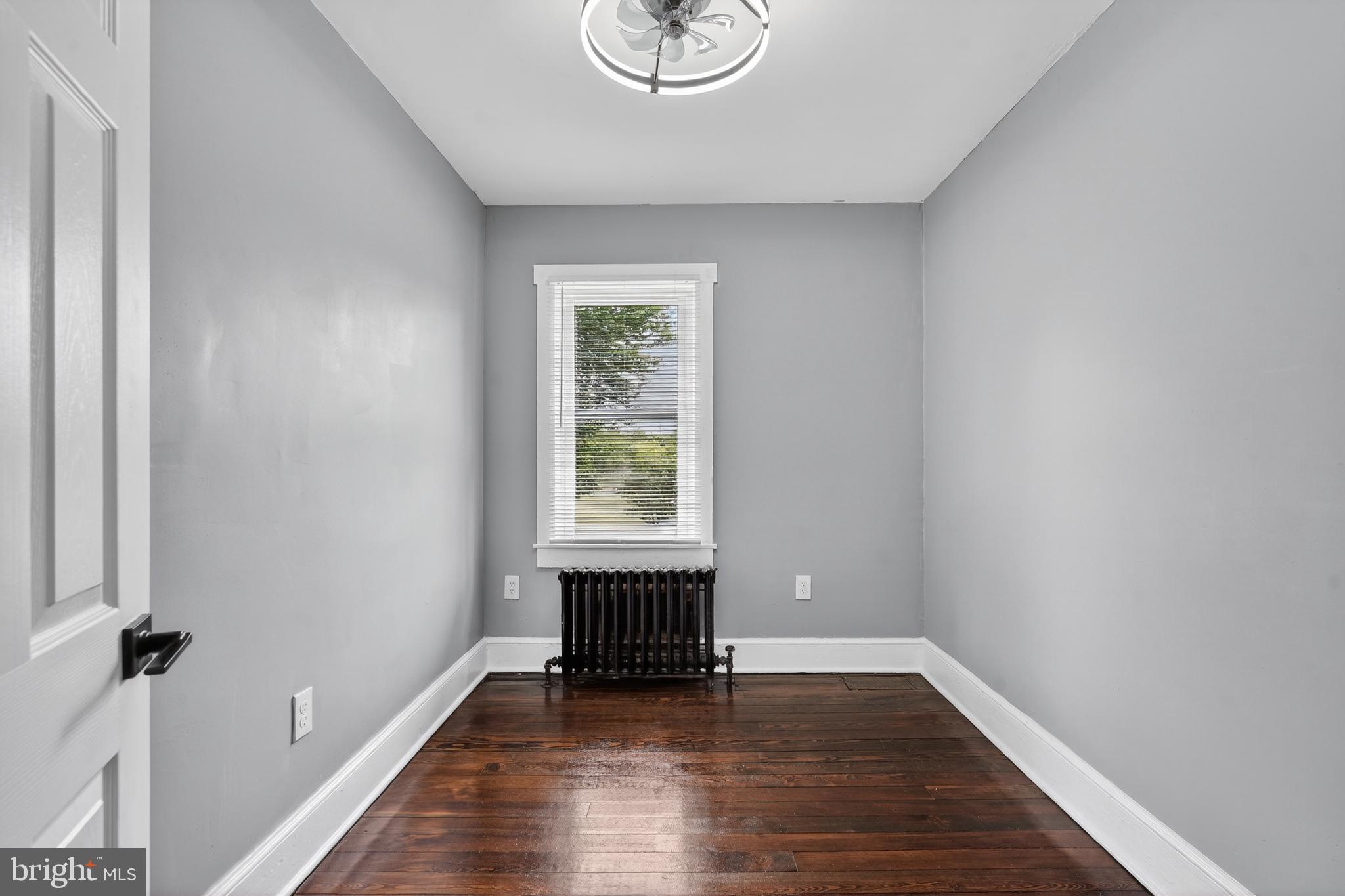 223 Noreg Place Brooklawn, NJ 08030 - Photo 29 of 36 a view of an empty room with wooden floor and a window