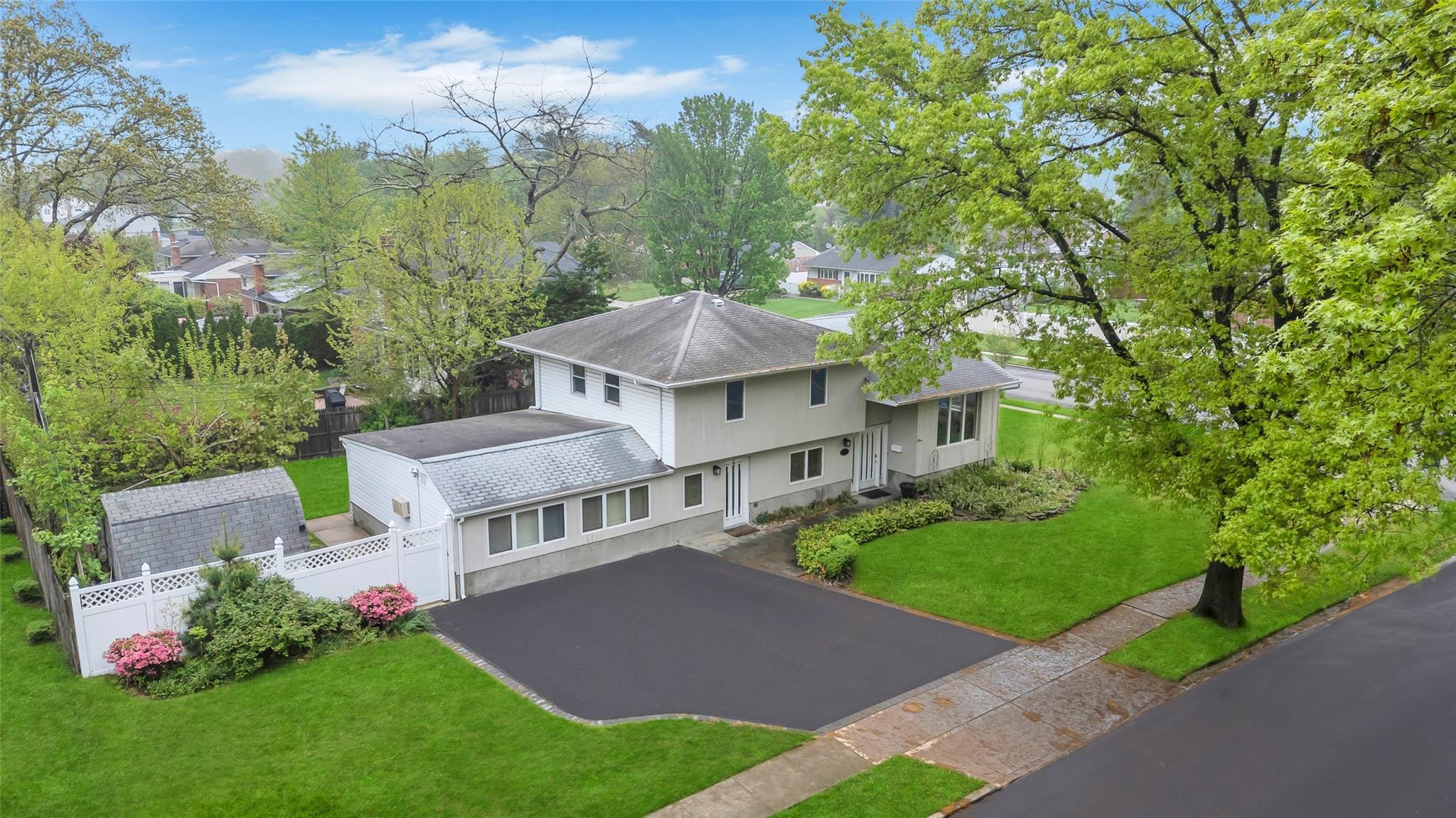 11 Rensselaer Drive Commack, NY 11725 - Photo 1 of 1 a front view of a house with a yard and potted plants