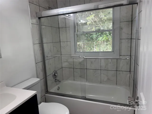a bathroom with a shower and bathtub
