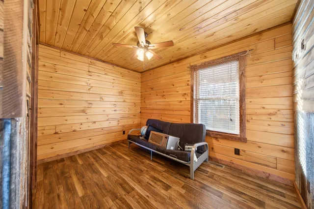 a bedroom with a bed and a flat tv screen