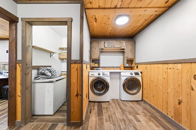 a backyard of a house with barbeque oven table and chairs