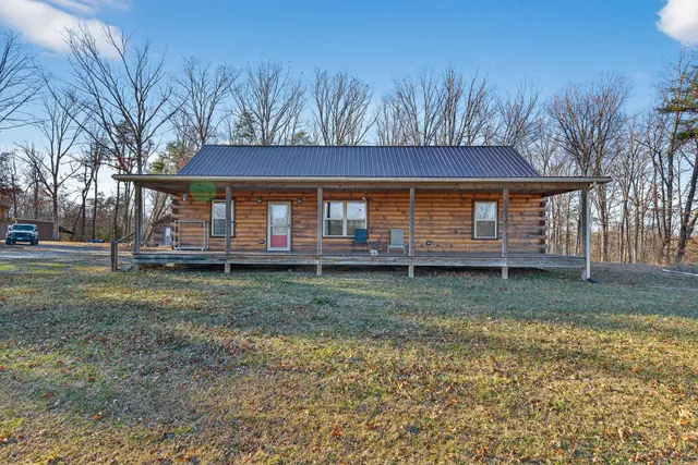 a view of large house with a yard
