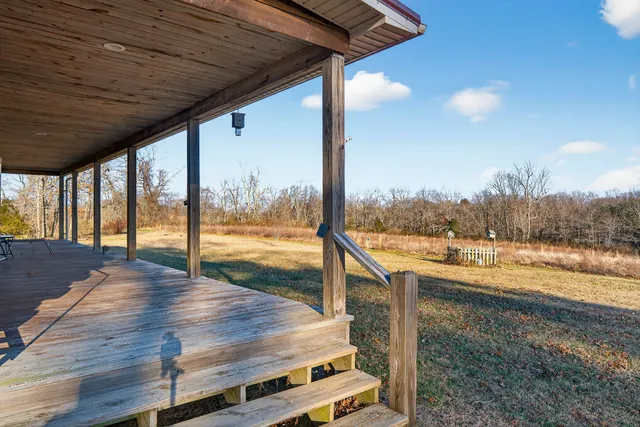 a view of a floor to ceiling window and wooden floor