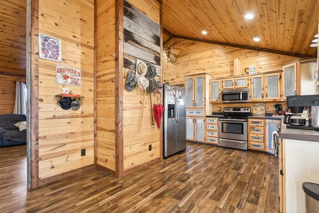 a view of a kitchen with stainless steel appliances and cabinets