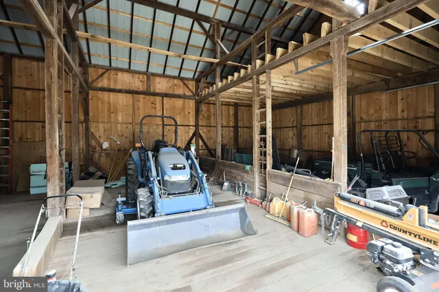 a bedroom with furniture and a large window