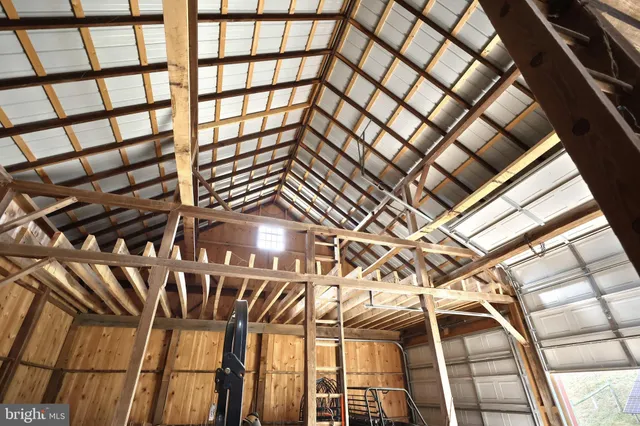 a bedroom with furniture and large window