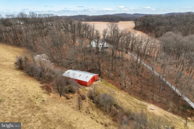 a bedroom with furniture and a flat screen tv
