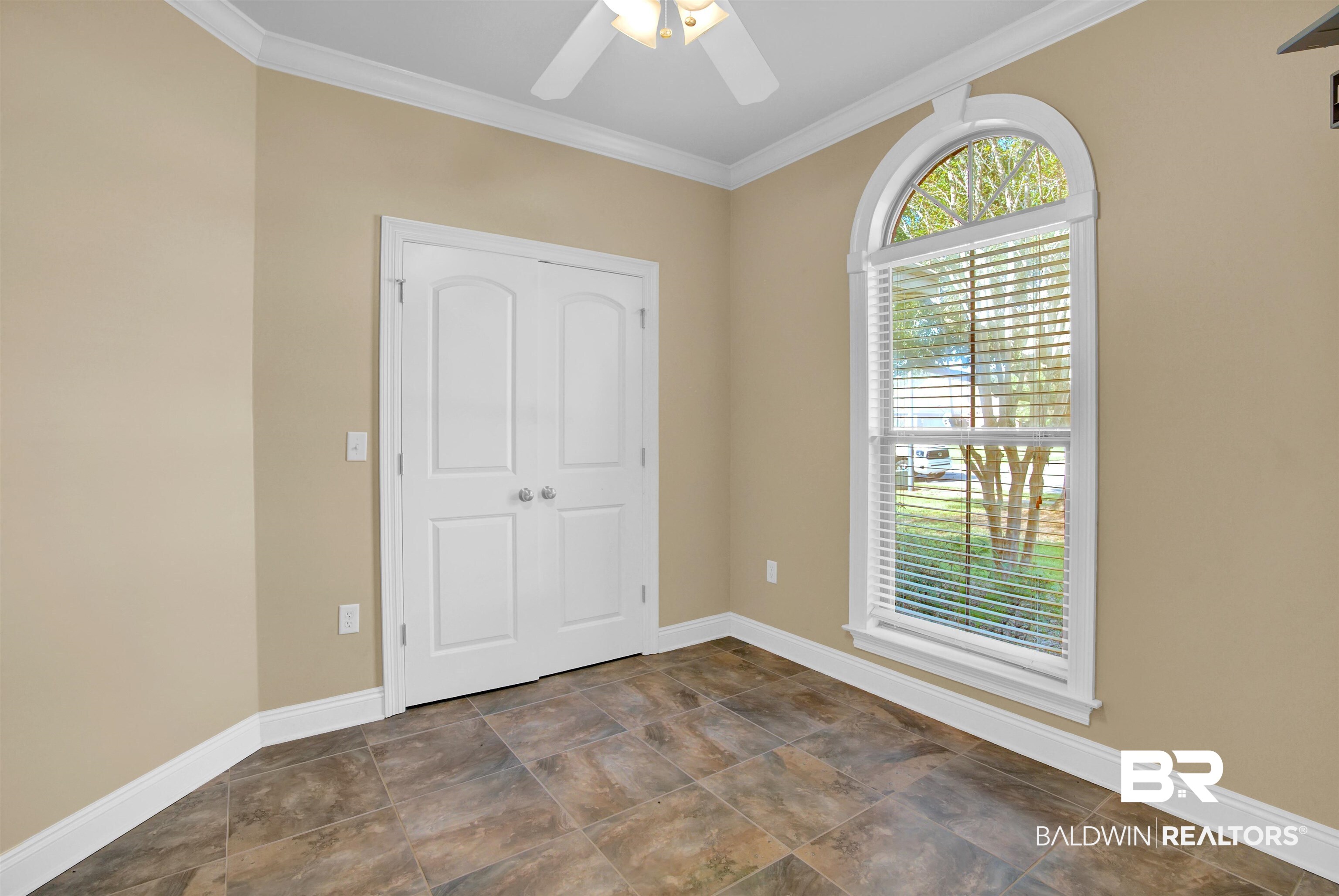 9532 Collier Loop Daphne, AL 36526 - Photo 5 of 45 Unfurnished room featuring ceiling fan and crown molding