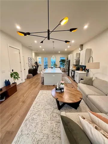 a living room with furniture and a lamp