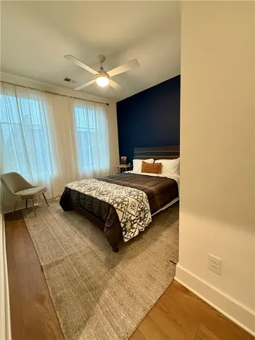 a bedroom with a bed and flat screen tv