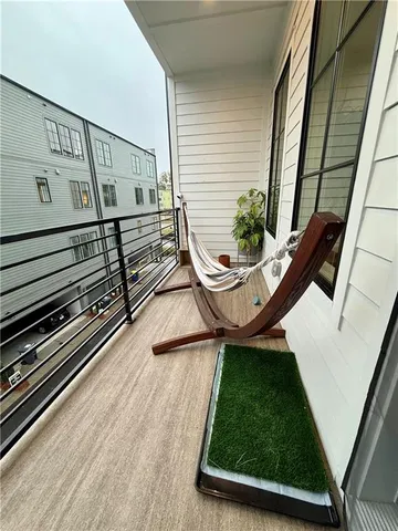 a view of a balcony with chairs