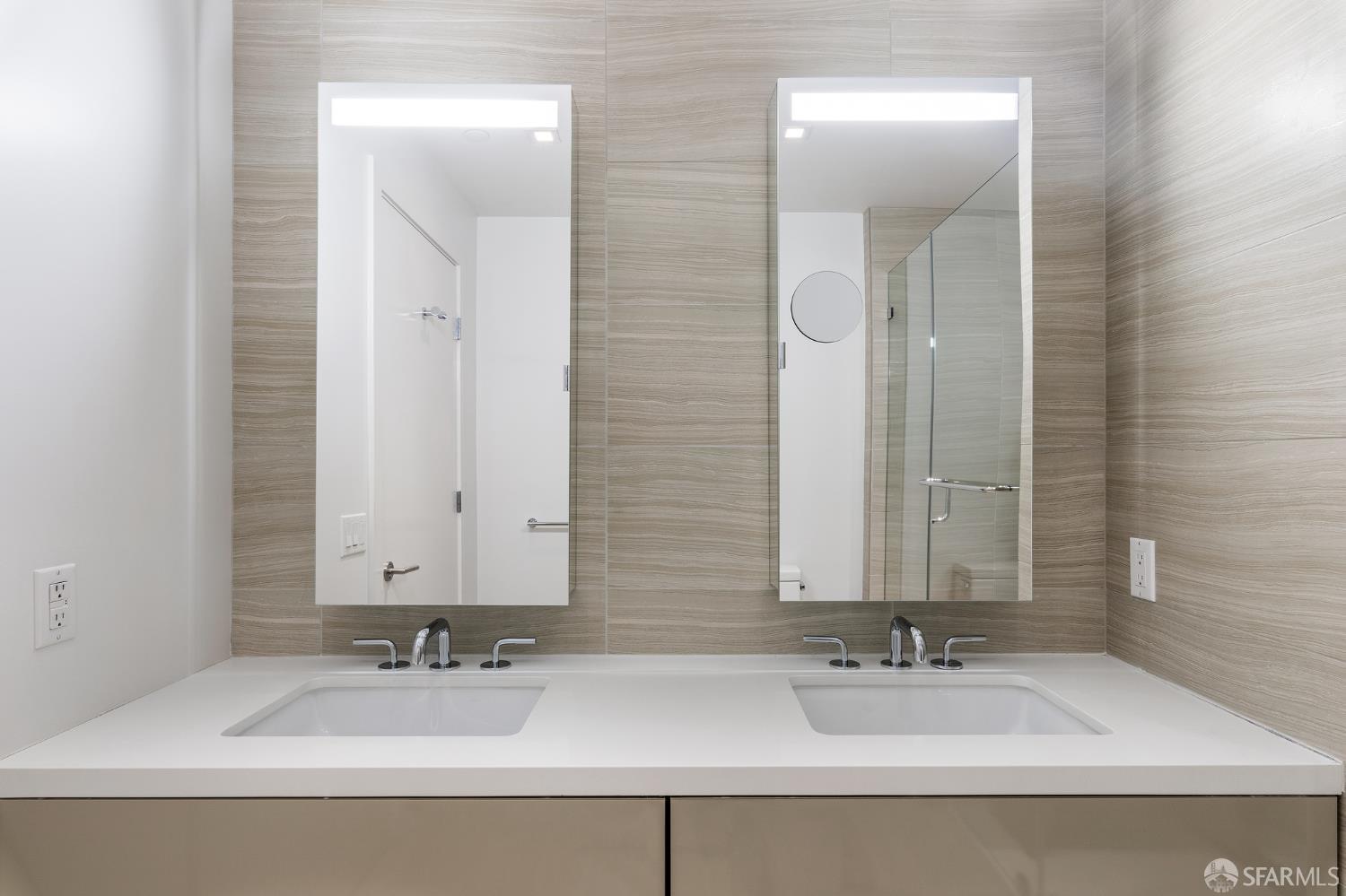 1450 Franklin Street, Unit 701 San Francisco, CA 94109 - Photo 12 of 20 a bathroom with double vanity sinks and a mirror