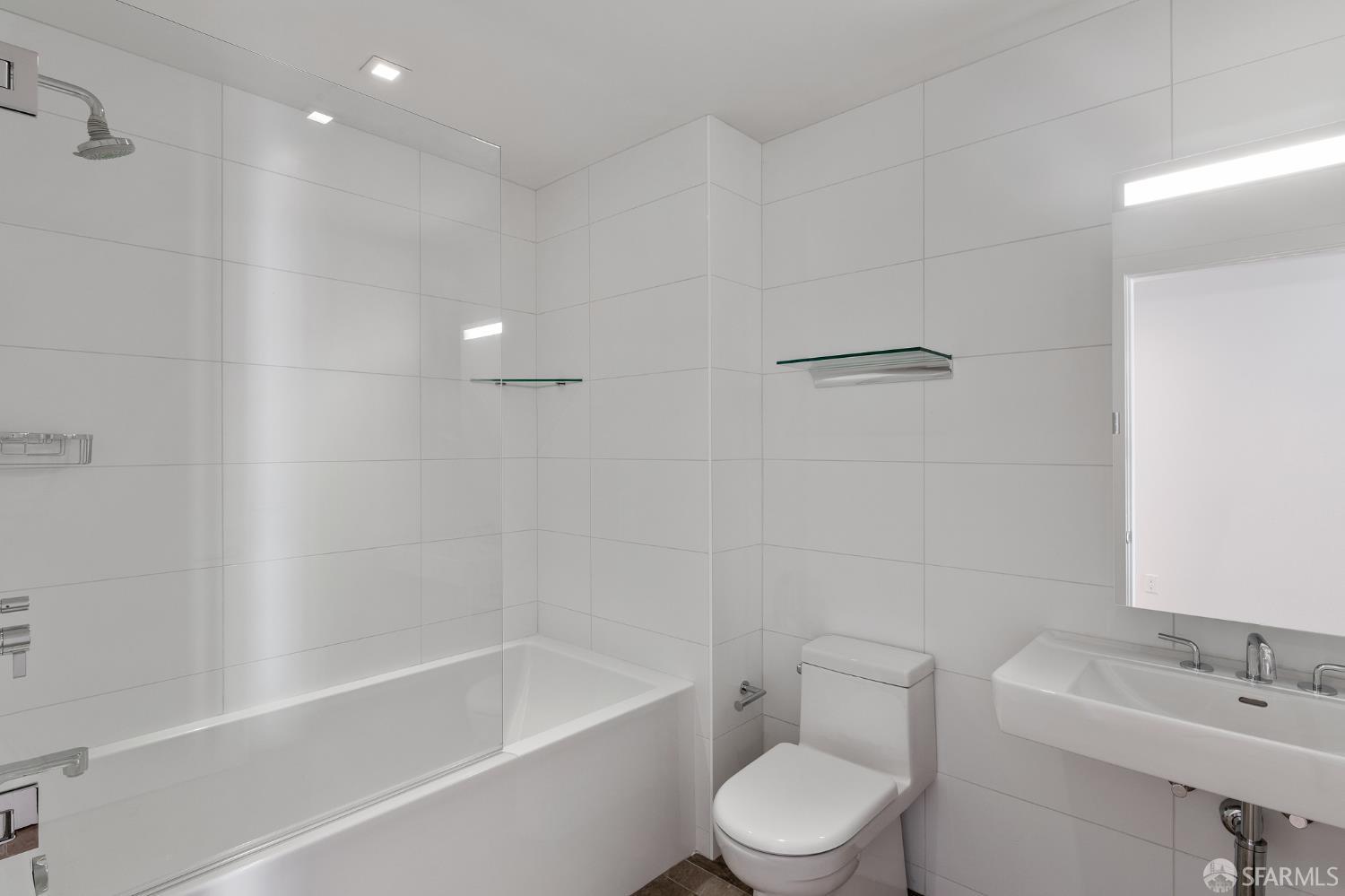 1450 Franklin Street, Unit 701 San Francisco, CA 94109 - Photo 16 of 20 a white toilet sitting next to a bath tub