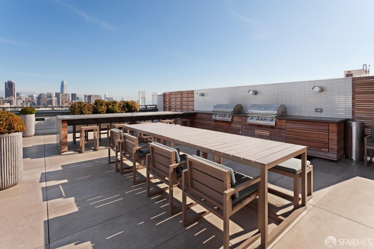 1450 Franklin Street, Unit 701 San Francisco, CA 94109 - Photo 17 of 20 a terrace with outdoor seating and flat screen tv