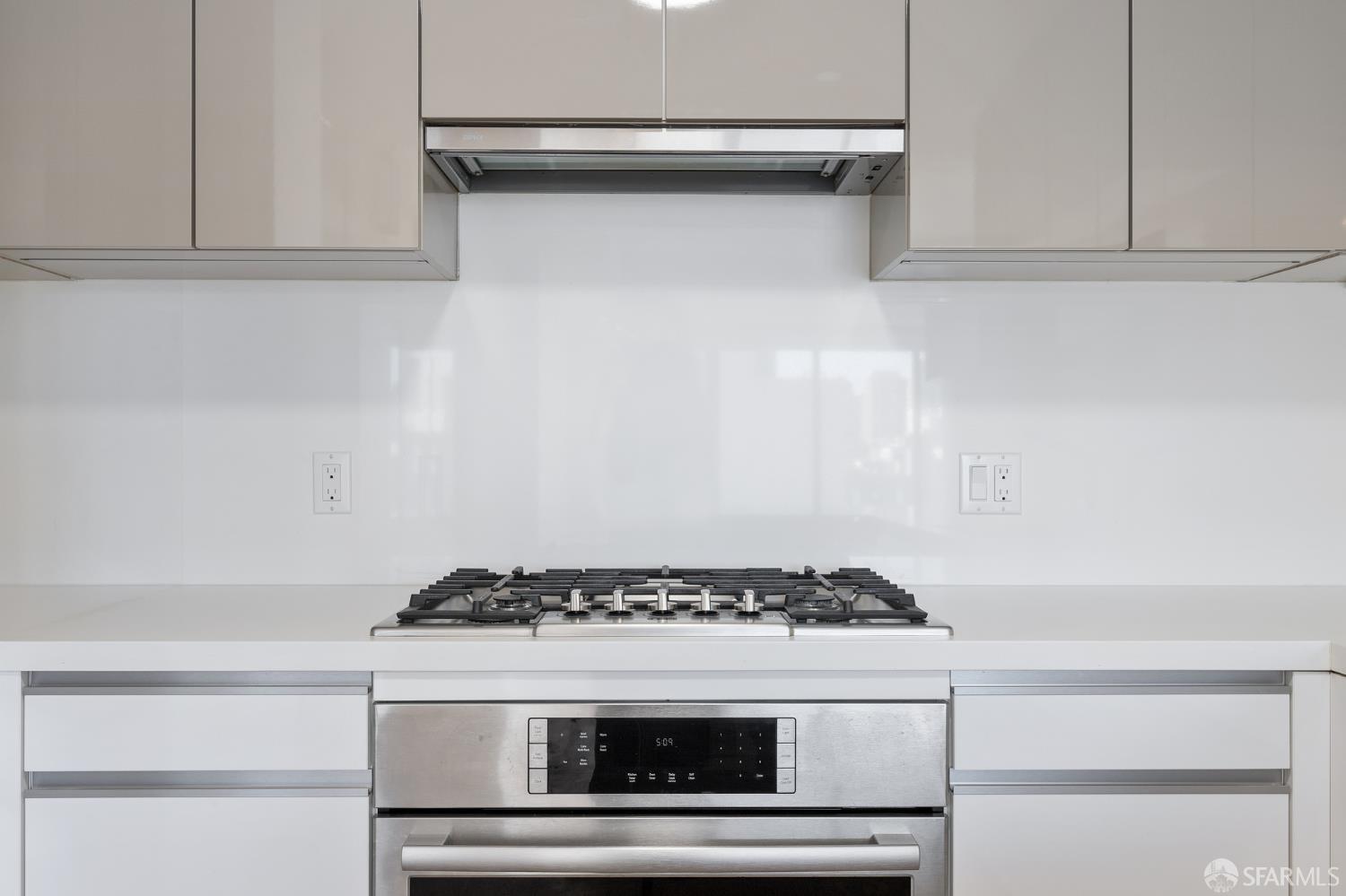 1450 Franklin Street, Unit 701 San Francisco, CA 94109 - Photo 6 of 20 a stove top oven sitting inside of a kitchen