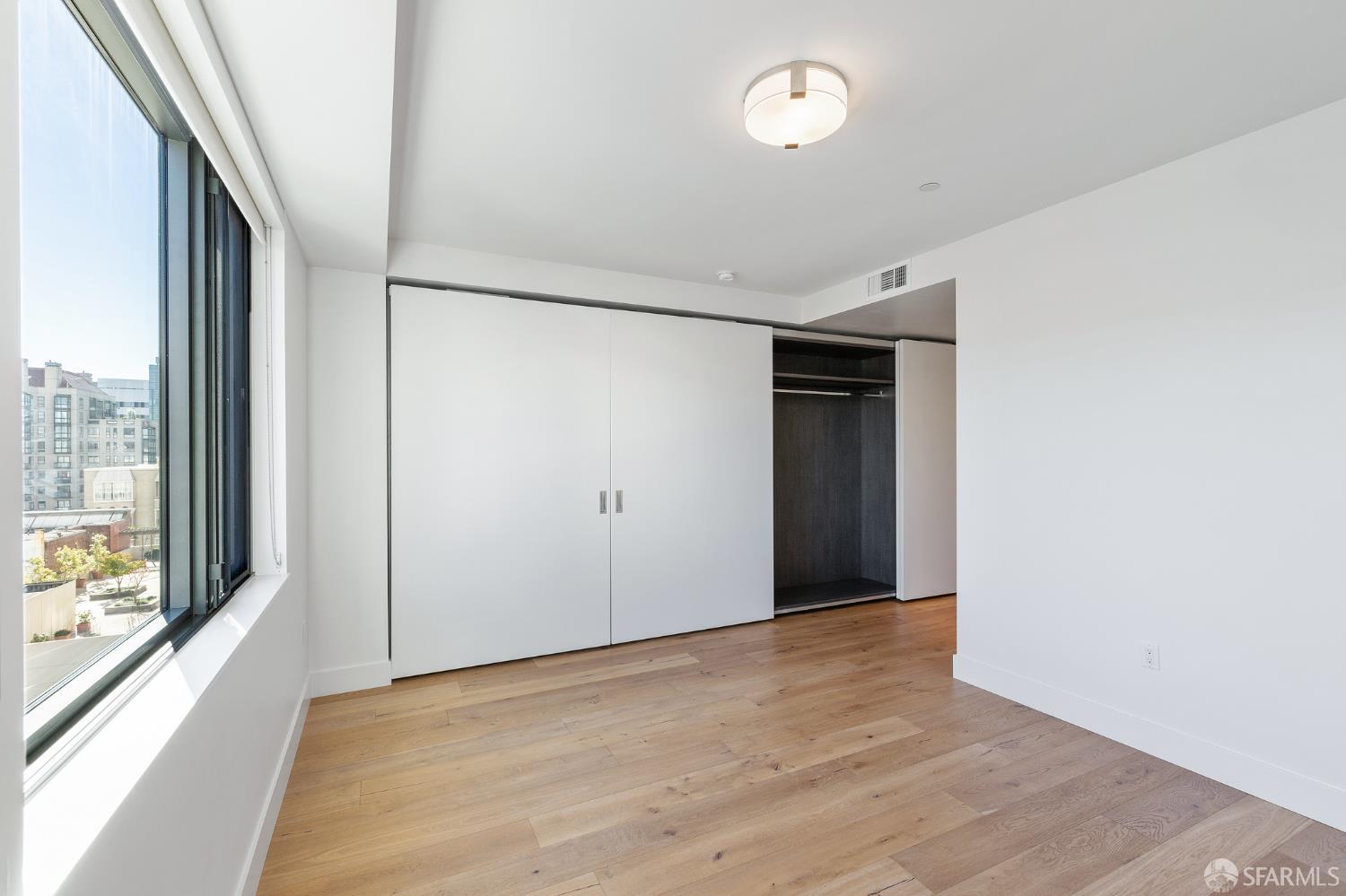 1450 Franklin Street, Unit 701 San Francisco, CA 94109 - Photo 9 of 20 a view of an empty room with glass door