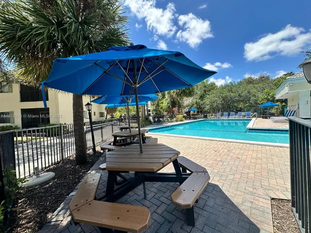 a view of a chairs and table in the yard