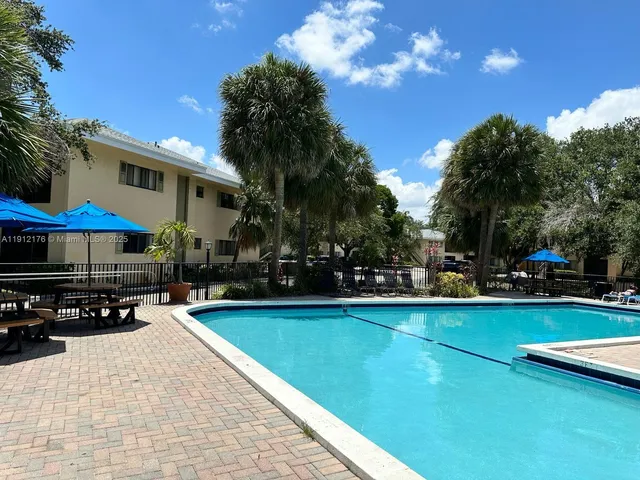a view of outdoor space with swimming pool and furniture