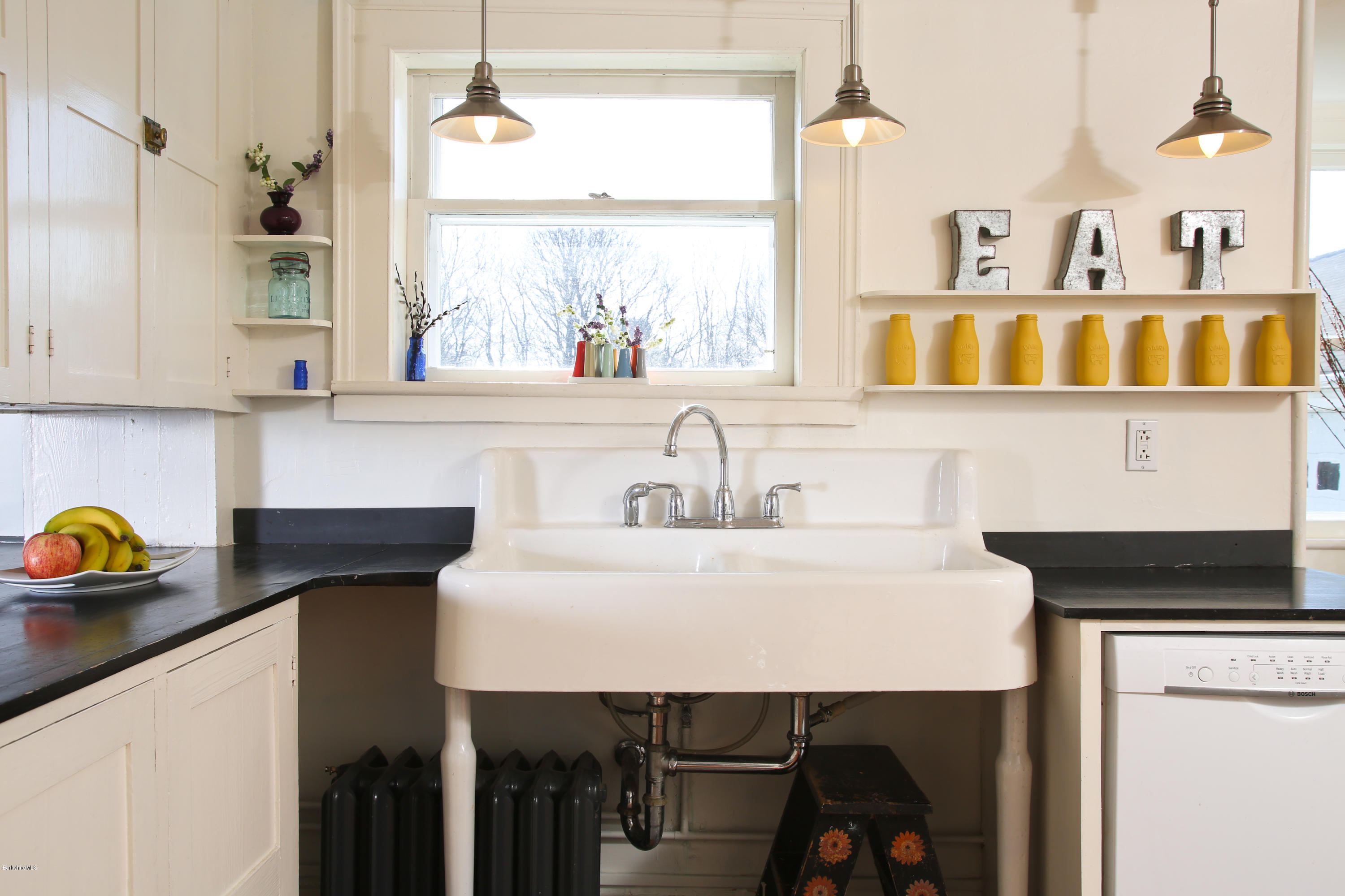 4105 Hancock Road Hancock, MA 01237 - Photo 15 of 57 a kitchen with a sink a stove and a window