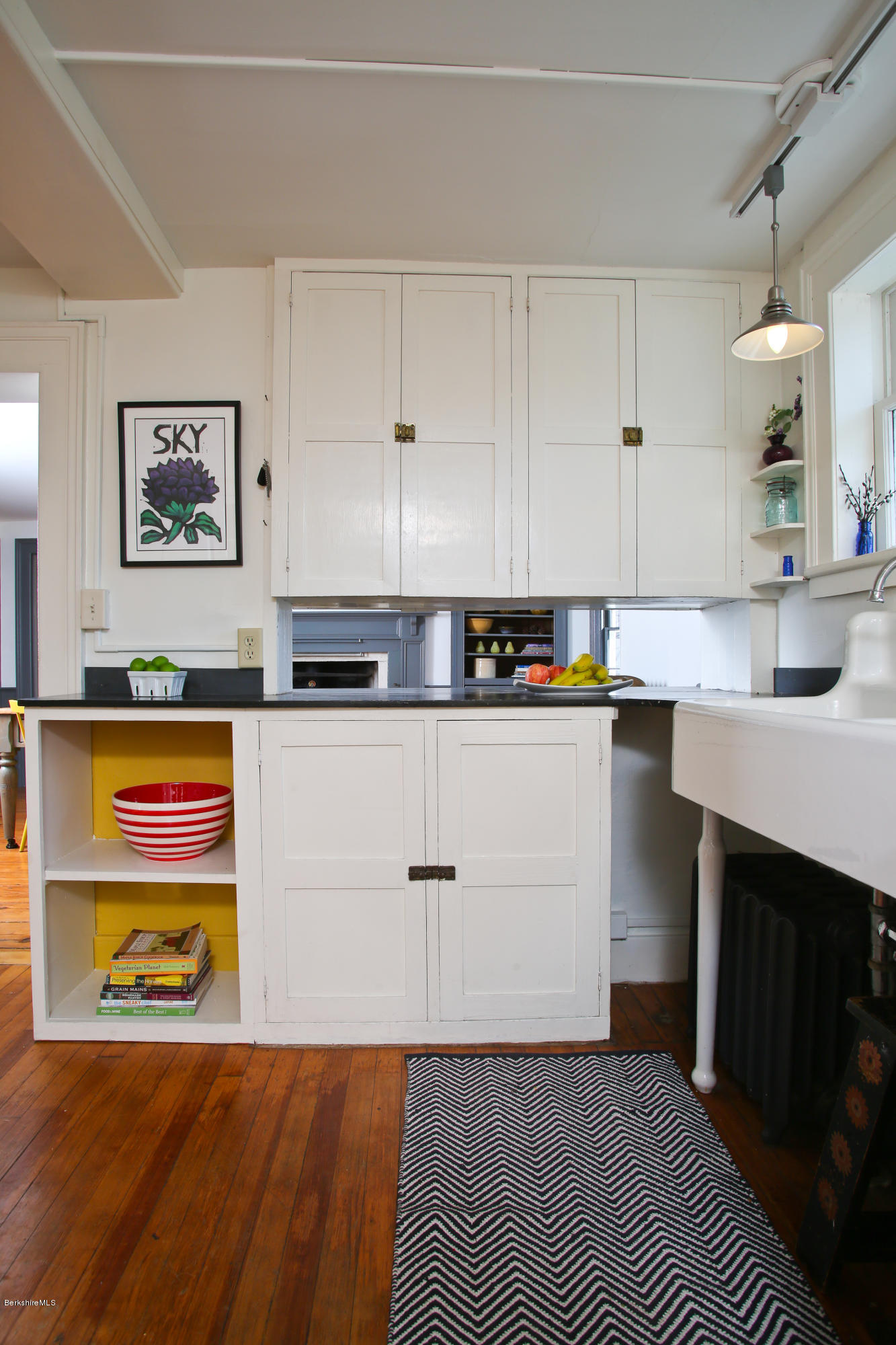 4105 Hancock Road Hancock, MA 01237 - Photo 16 of 57 a kitchen with stainless steel appliances granite countertop a sink a stove a microwave a sink and white cabinets