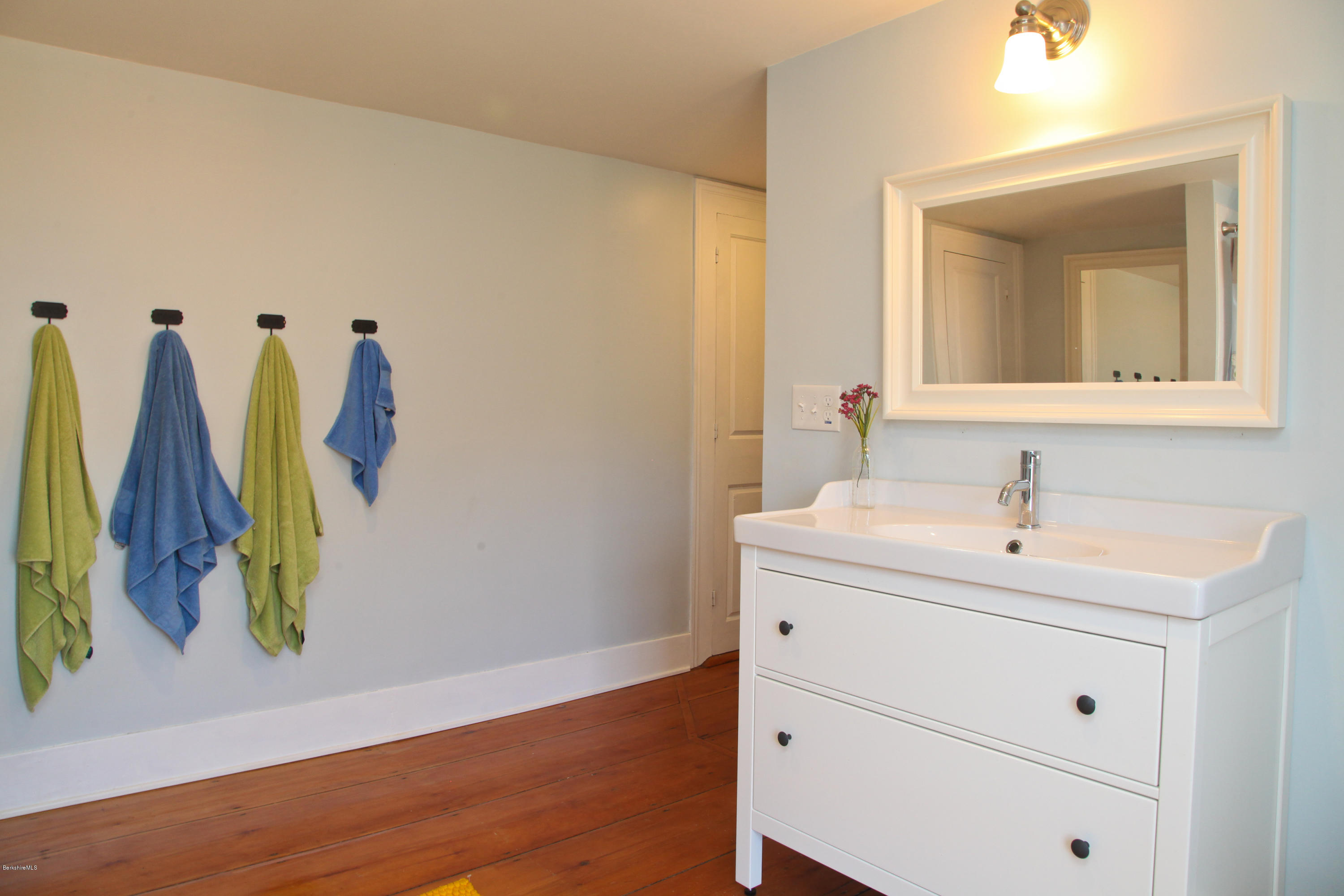 4105 Hancock Road Hancock, MA 01237 - Photo 46 of 57 a bathroom with a sink and a mirror