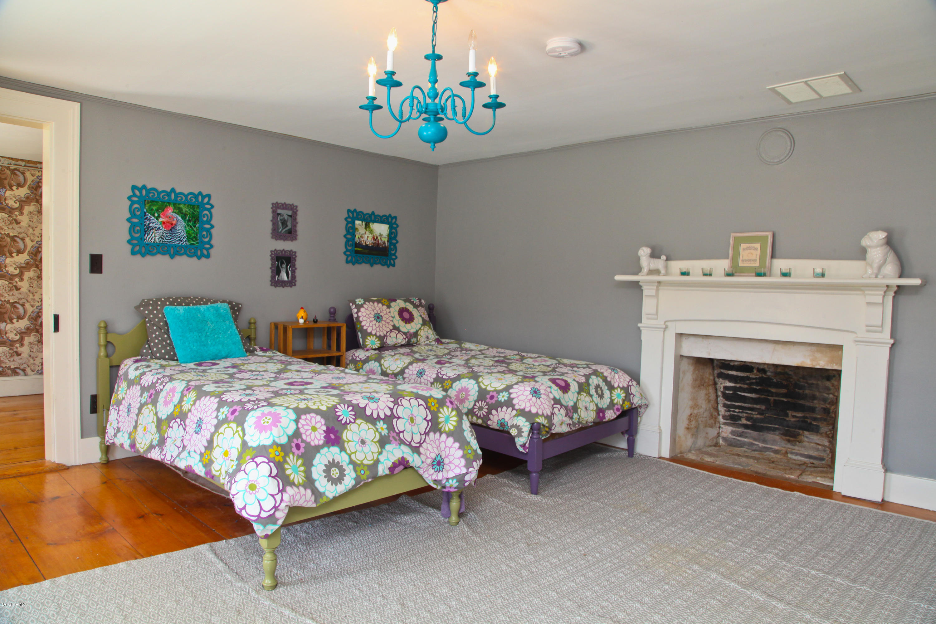 4105 Hancock Road Hancock, MA 01237 - Photo 47 of 57 a bedroom with a bed and a fireplace