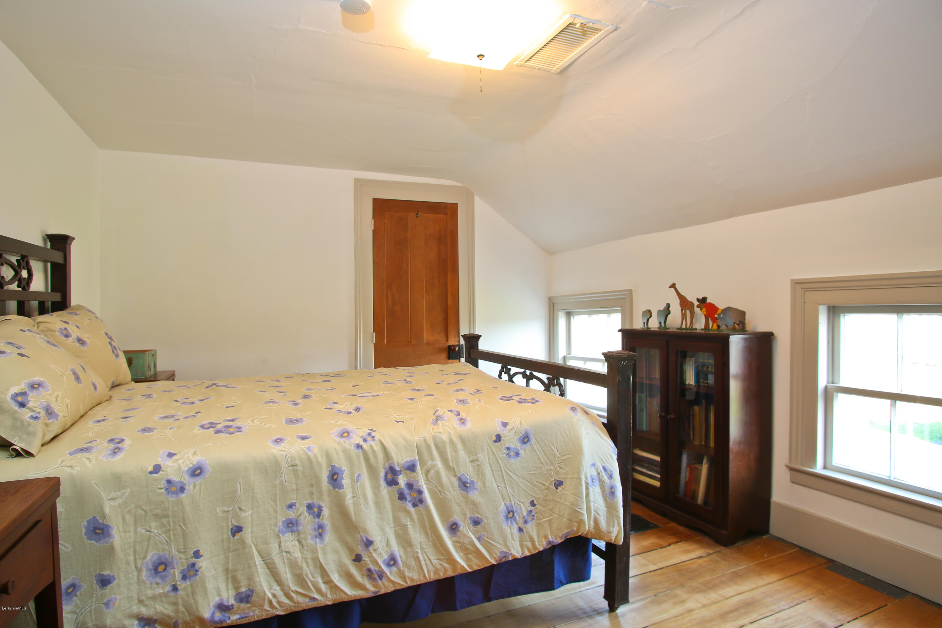 4105 Hancock Road Hancock, MA 01237 - Photo 51 of 57 a bedroom with a bed and wooden floor