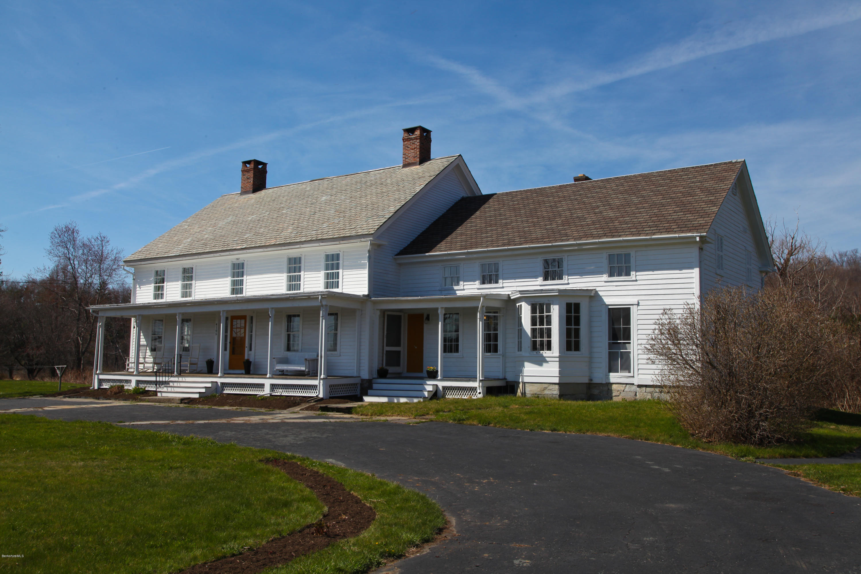 4105 Hancock Road Hancock, MA 01237 - Photo 56 of 57 a front view of a residential apartment building with a yard