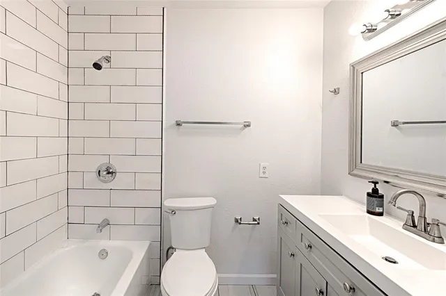 a view of a hallway with washer and dryer