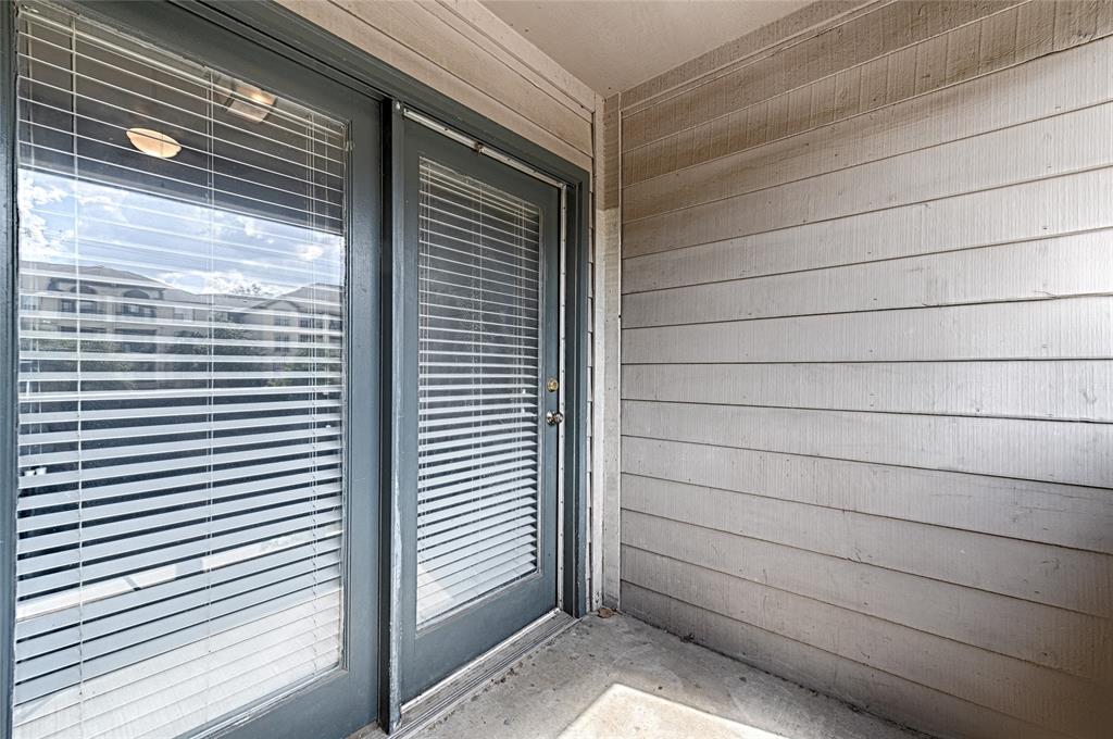 8545 Midpark Road, Unit 2 Dallas, TX 75240 - Photo 19 of 19 a view of a back yard of the house