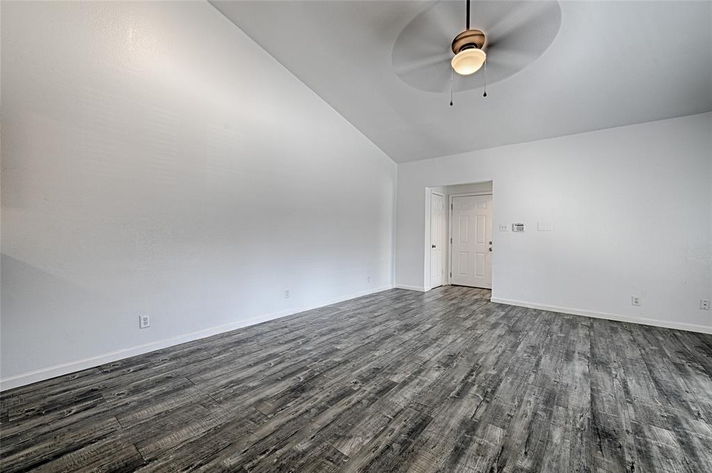 8545 Midpark Road, Unit 2 Dallas, TX 75240 - Photo 4 of 19 a view of empty room with wooden floor