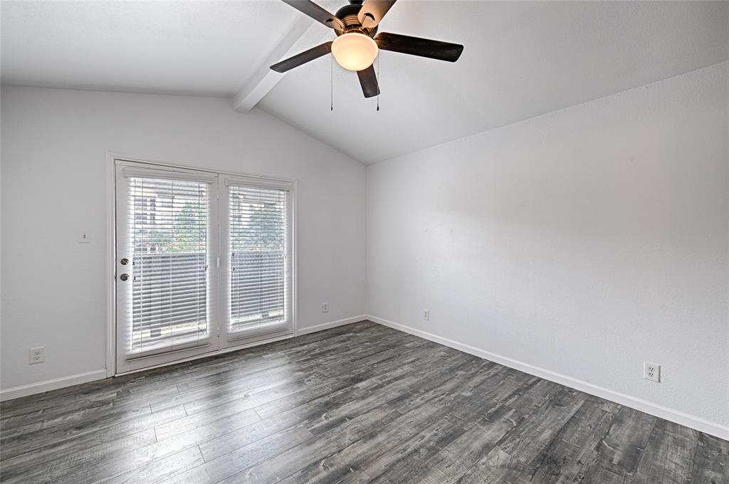 8545 Midpark Road, Unit 2 Dallas, TX 75240 - Photo 8 of 19 wooden floor in an empty room with a window