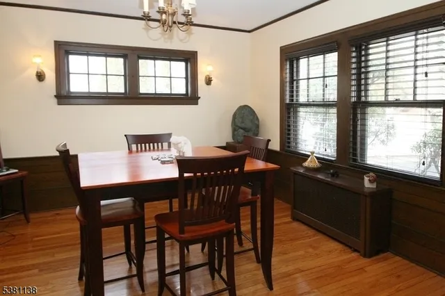 a view of a dining room with furniture and window