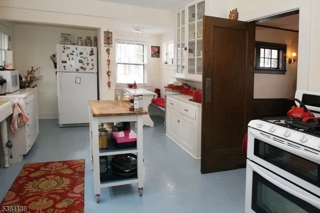 a bedroom with a bed dresser and a window