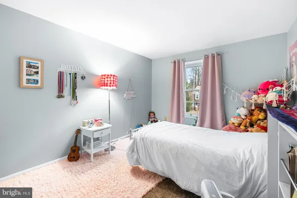 a bedroom with furniture and a bed