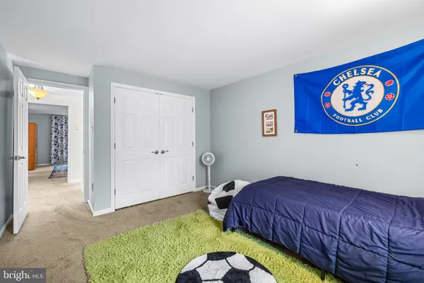 a bathroom with a toilet a sink and a mirror