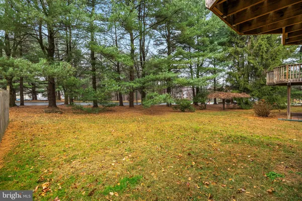 a swimming pool with outdoor seating and yard
