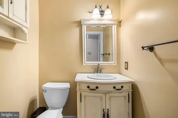 a view of a hallway with living room and furniture