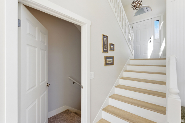 7935 Mustang Loop Road Park City, UT 84098 - Photo 30 of 60 Entryway featuring a six-panel front door with a sidelight and arched transom window