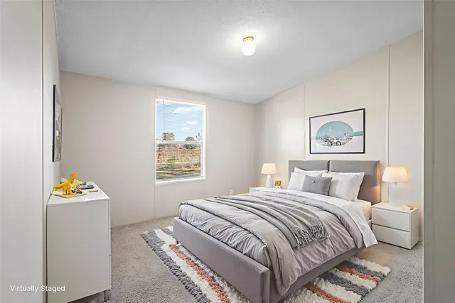 a view of an empty room and a window