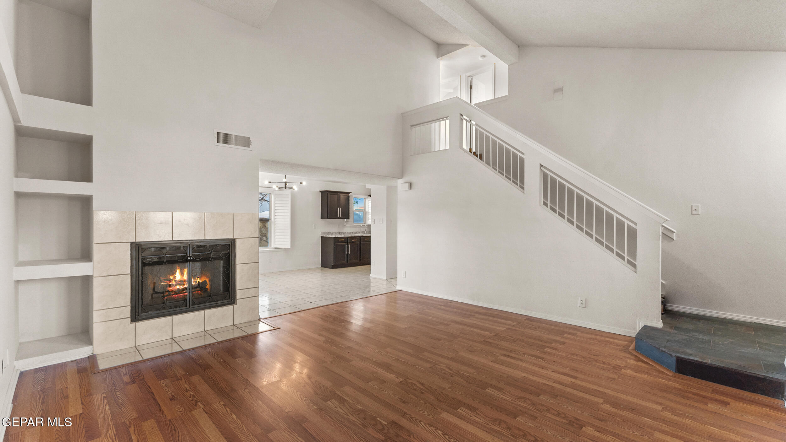 1729 St Mark Avenue El Paso, TX 79936 - Photo 15 of 31 a view of a livingroom with wooden floor and a fireplace
