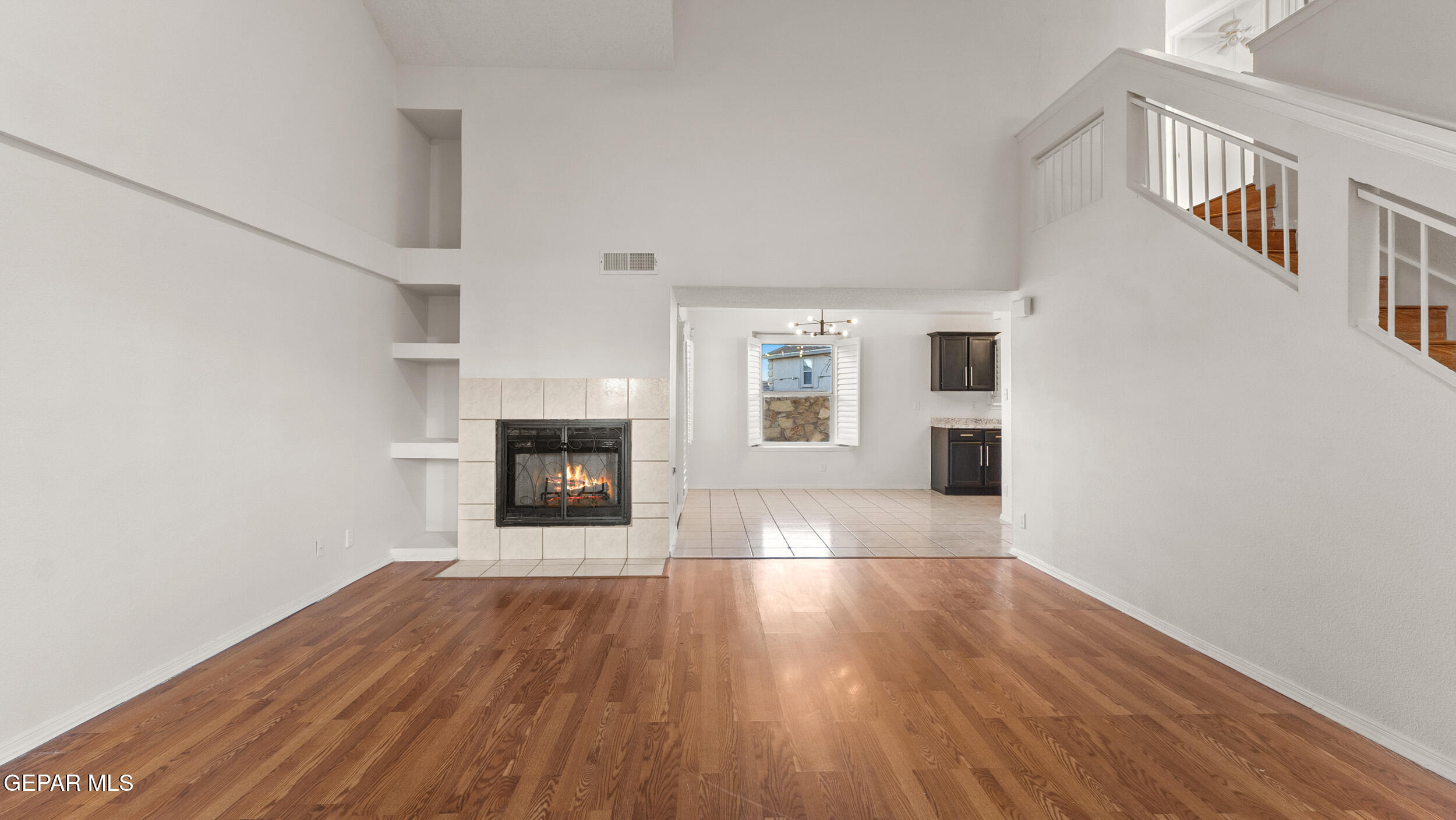 1729 St Mark Avenue El Paso, TX 79936 - Photo 16 of 31 a view of an empty room with window and wooden floor