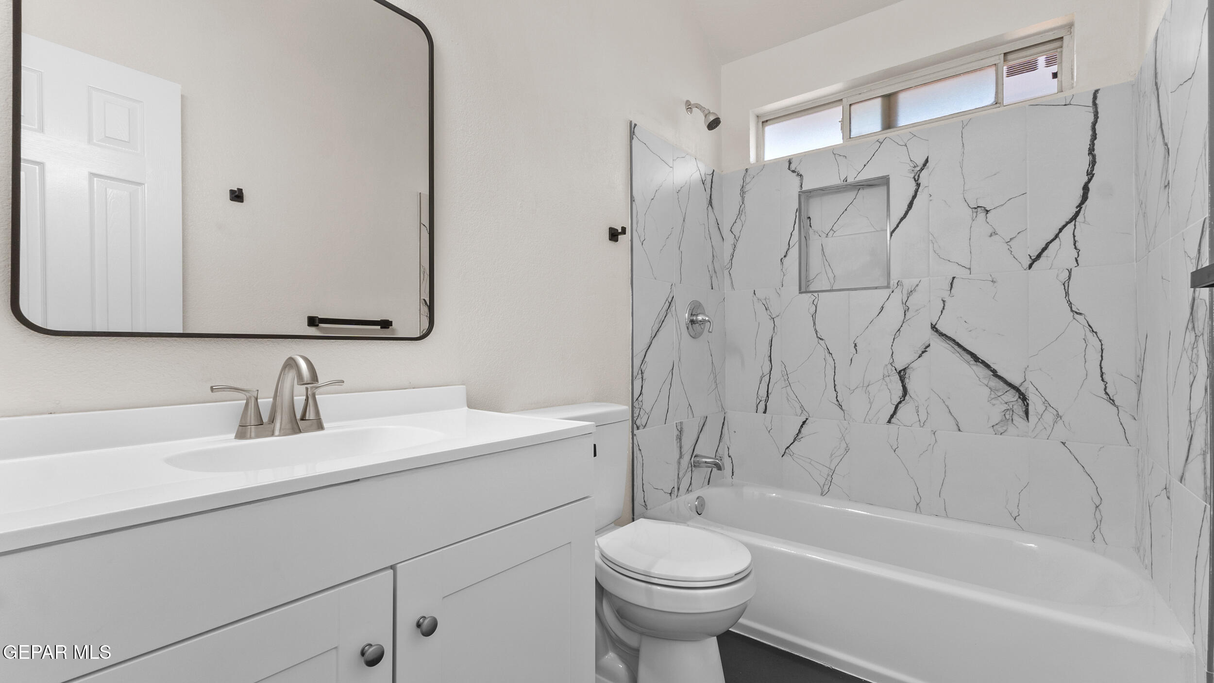 1729 St Mark Avenue El Paso, TX 79936 - Photo 21 of 31 a bathroom with a sink toilet and shower