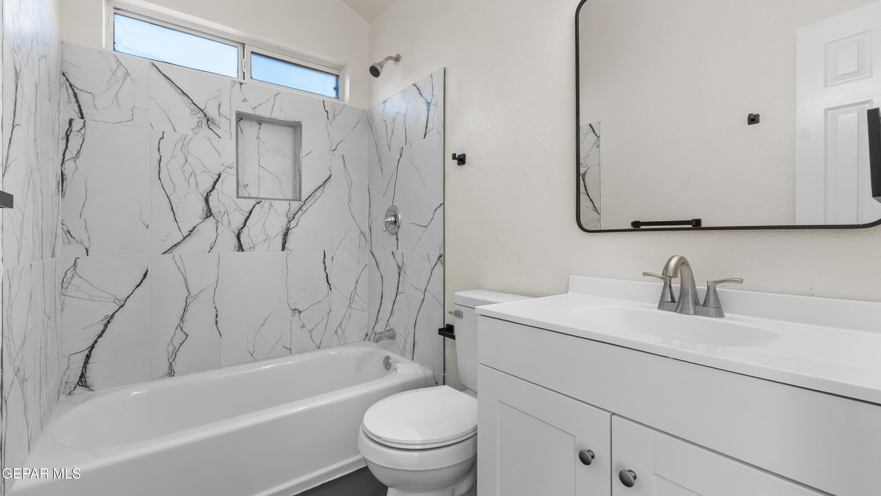 1729 St Mark Avenue El Paso, TX 79936 - Photo 23 of 31 a bathroom with a granite countertop sink toilet and shower