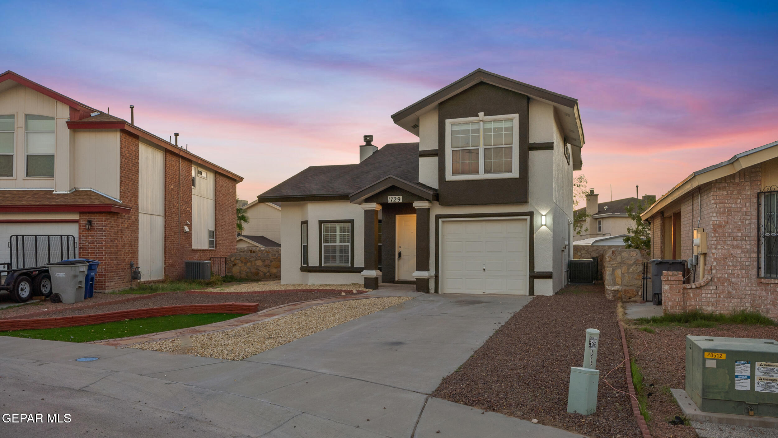 1729 St Mark Avenue El Paso, TX 79936 - Photo 3 of 31 a front view of a house with a yard