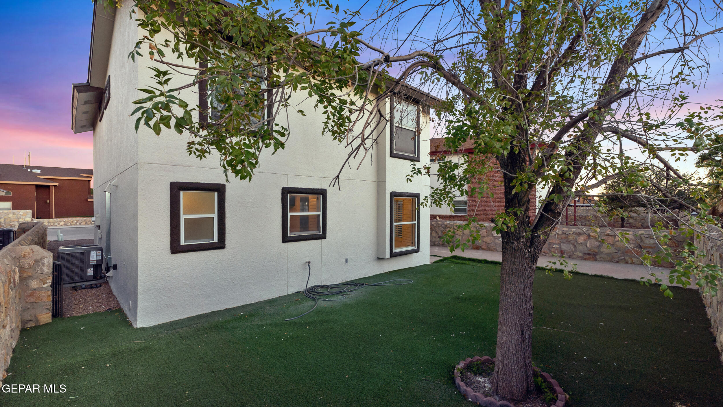 1729 St Mark Avenue El Paso, TX 79936 - Photo 5 of 31 a backyard of a house with table and chairs
