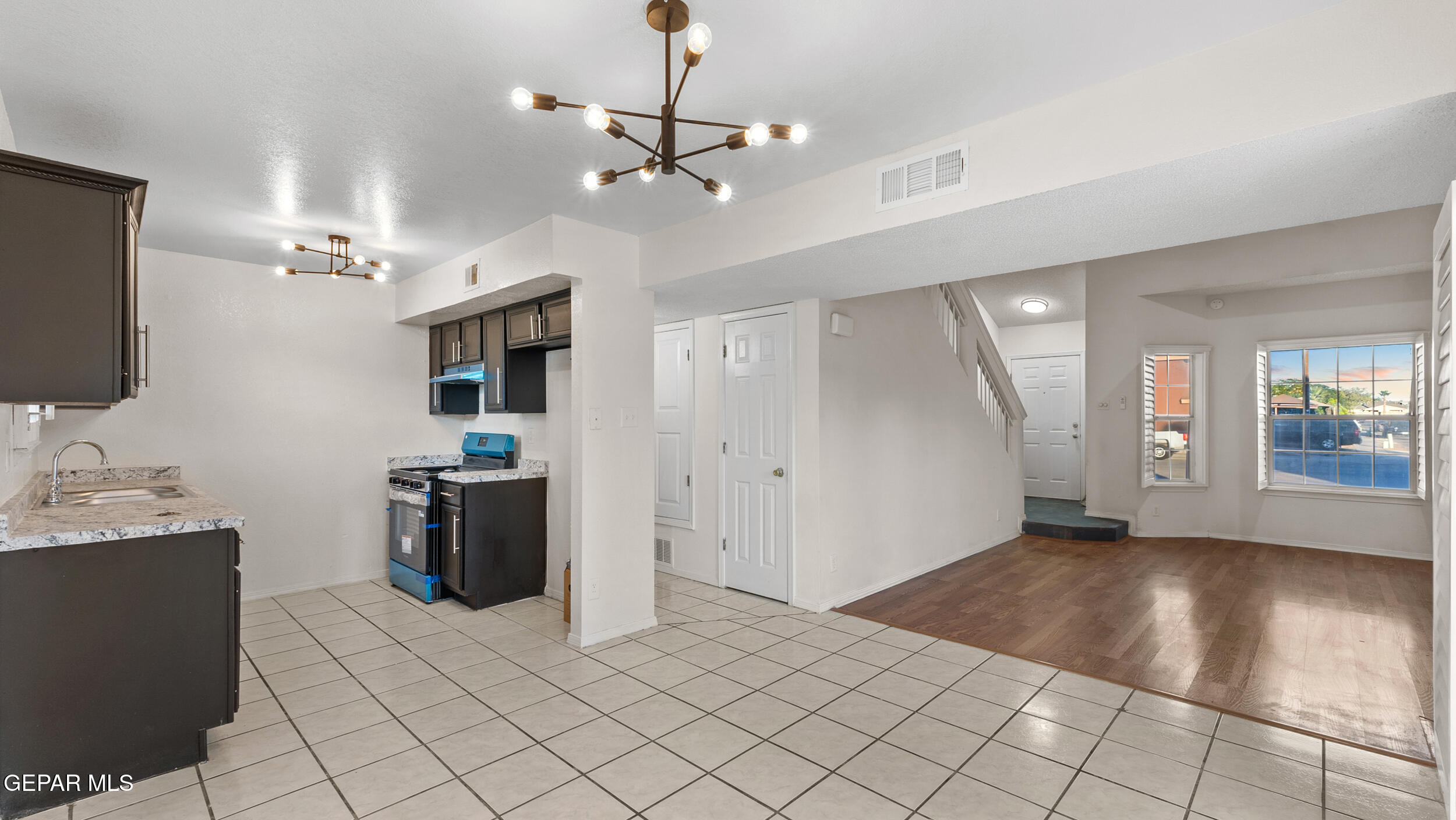 1729 St Mark Avenue El Paso, TX 79936 - Photo 9 of 31 a view of a livingroom with furniture and chandelier