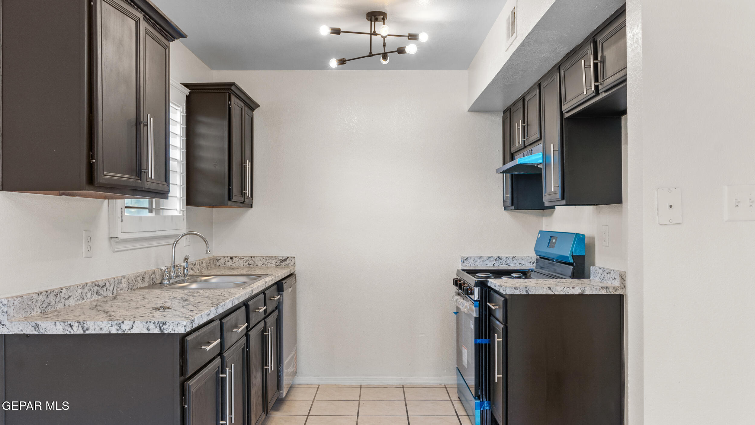 1729 St Mark Avenue El Paso, TX 79936 - Photo 10 of 31 a bathroom with a sink double vanity and a mirror