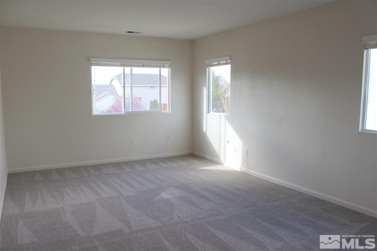 10409 Summershade Lane Reno, NV 89521 - Photo 11 of 22 an empty room with windows