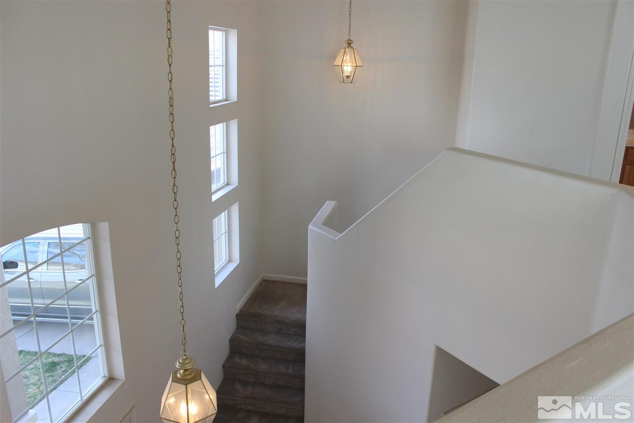 10409 Summershade Lane Reno, NV 89521 - Photo 13 of 22 wooden floor in an empty room with a window
